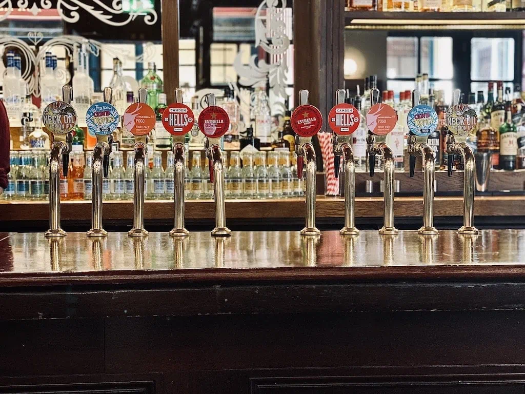 The beer taps at New Moon, a London pub