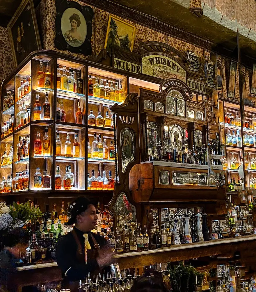 The wall of whiskey at Oscar Wilde in Manhattan, NYC