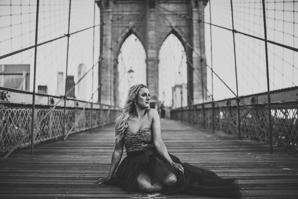Sitting on the Brooklyn Bridge in New York City