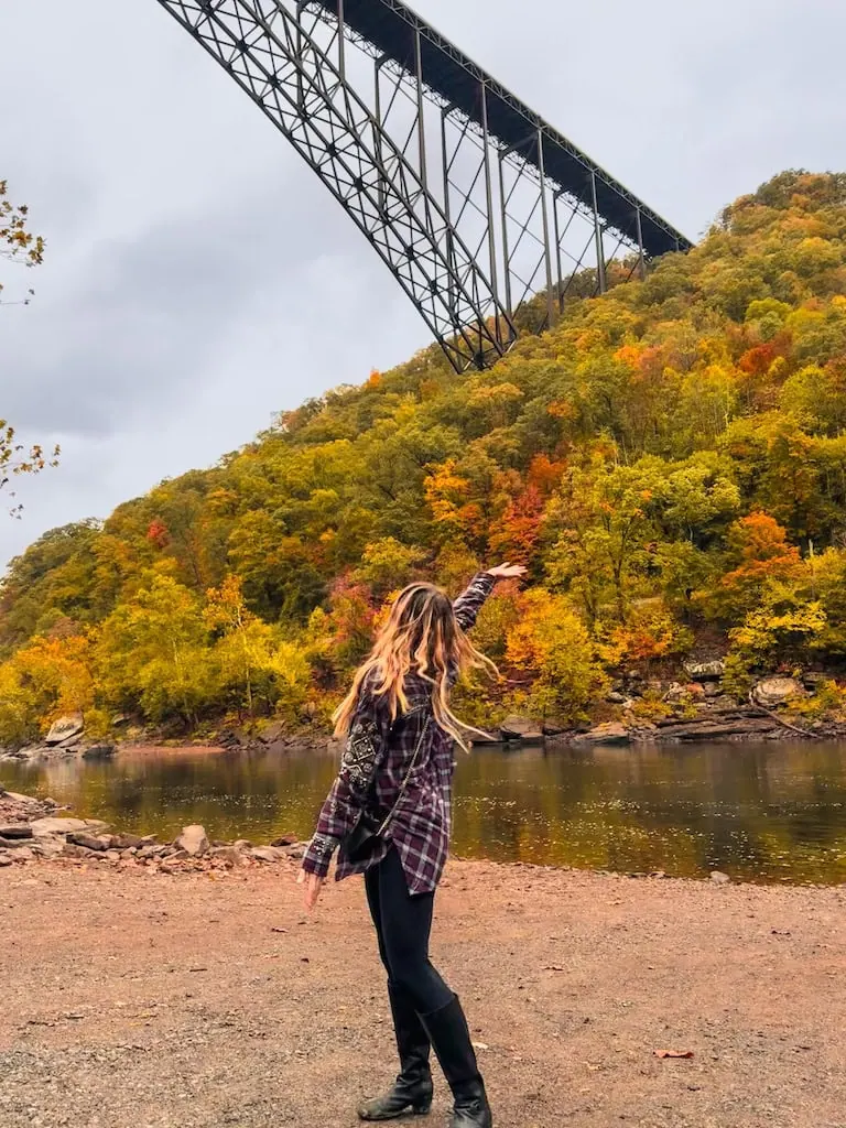 Girl with the New River Gorge Bridge behind her. Fayetteville, WV