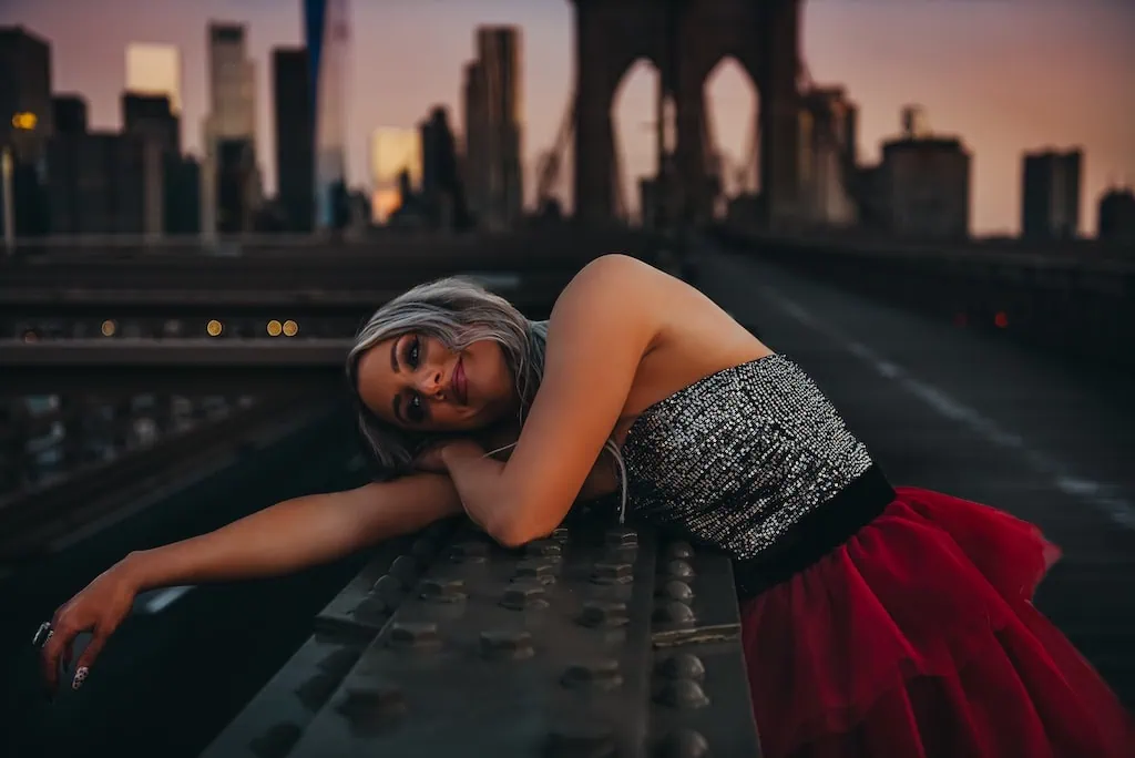Girl in a red tulle skirt on the Brooklyn Bridge, NYC