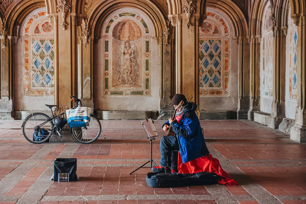 A street musician inside Bethesda Arcade