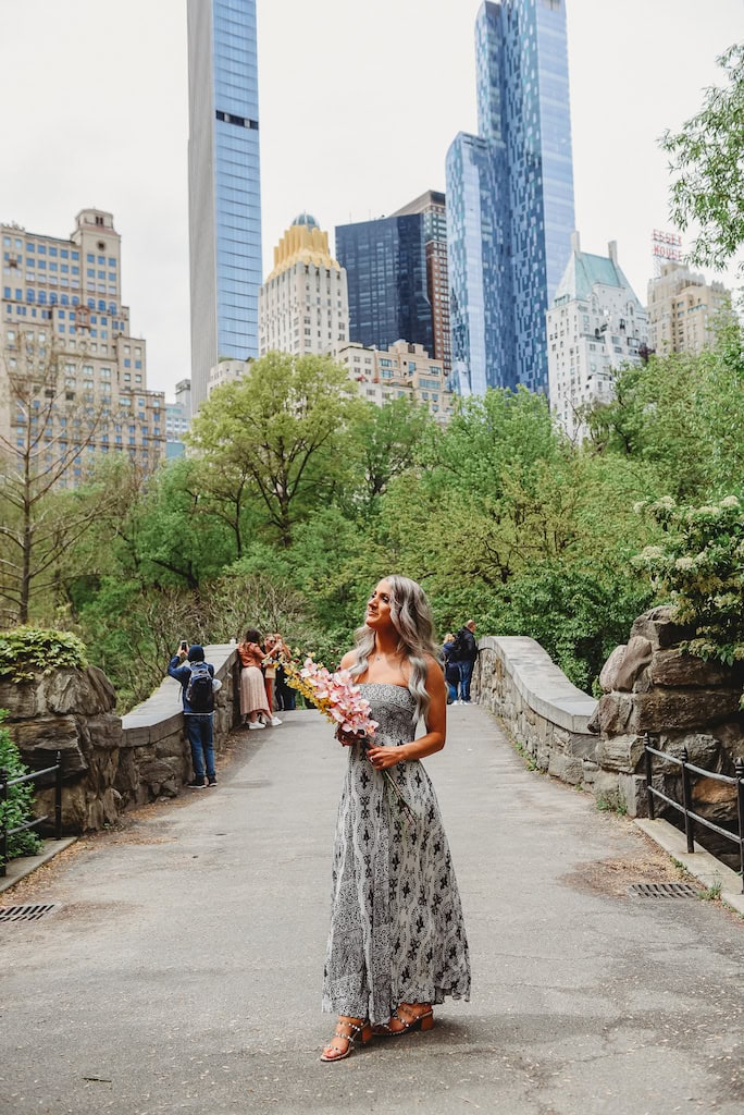 Girl holding flowers in Central Park, New York City