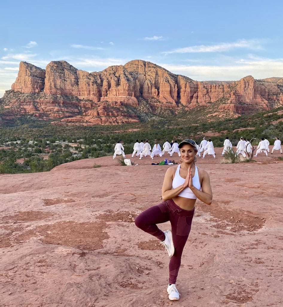 Doing yoga on the Bell Rock vortex with people doing martial arts in the background. Sedona, AZ