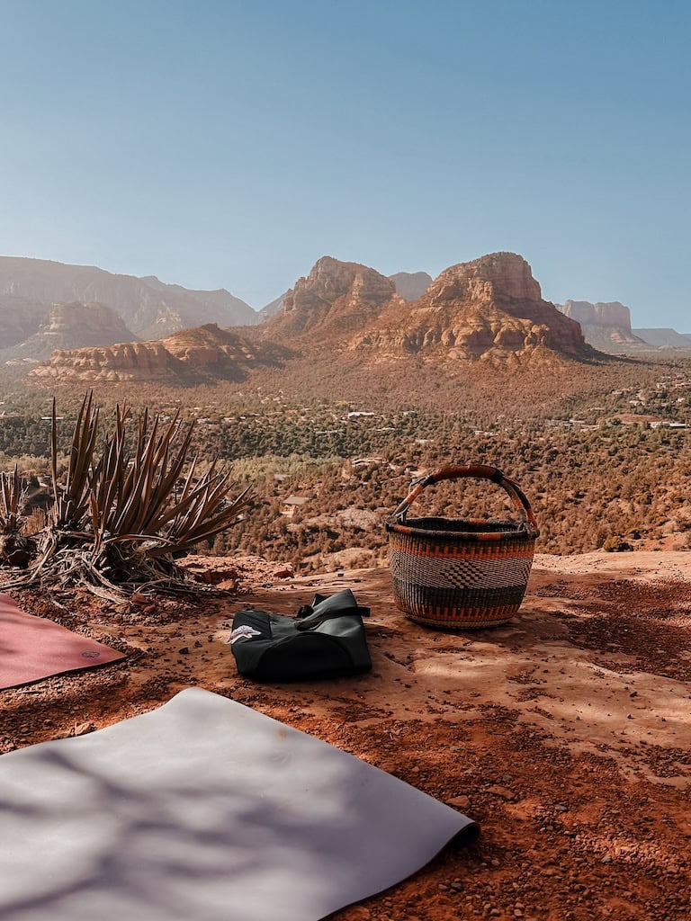 Yoga mats and a view of the red rocks on the Airport Mesa Vortex. Sedona, AZ