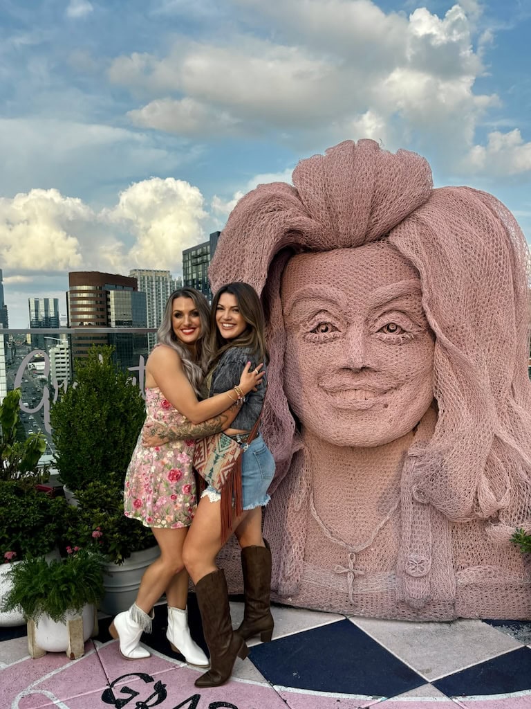 Girls with the Dolly Parton statue at White Limozeen; Nashville, TN