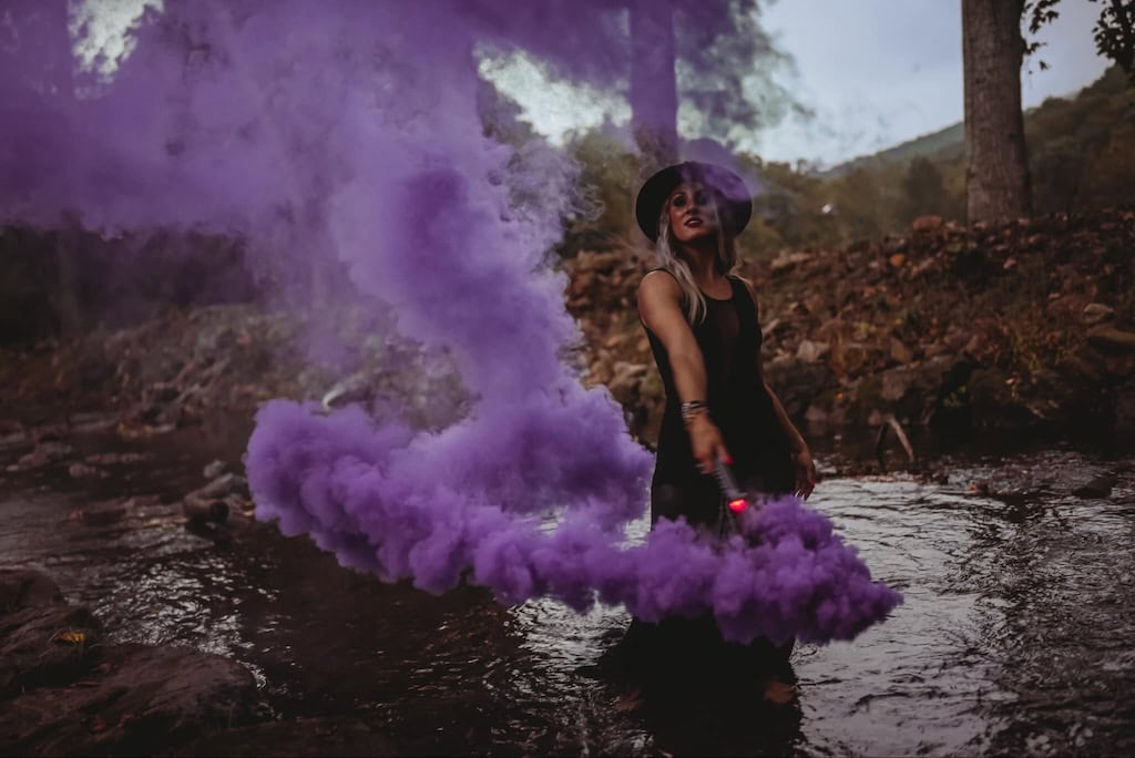 Purple smoke bomb witchy photo in the water