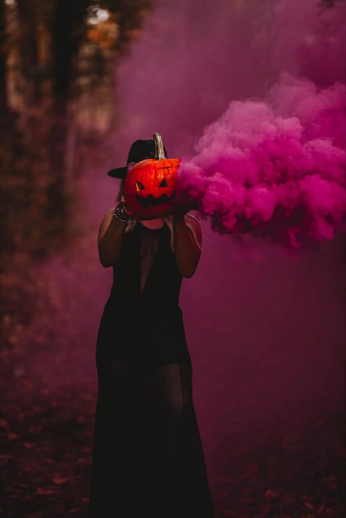 Pumpkin Head shot using a smoke bomb. Smoking pumpkin. Halloween photoshoot