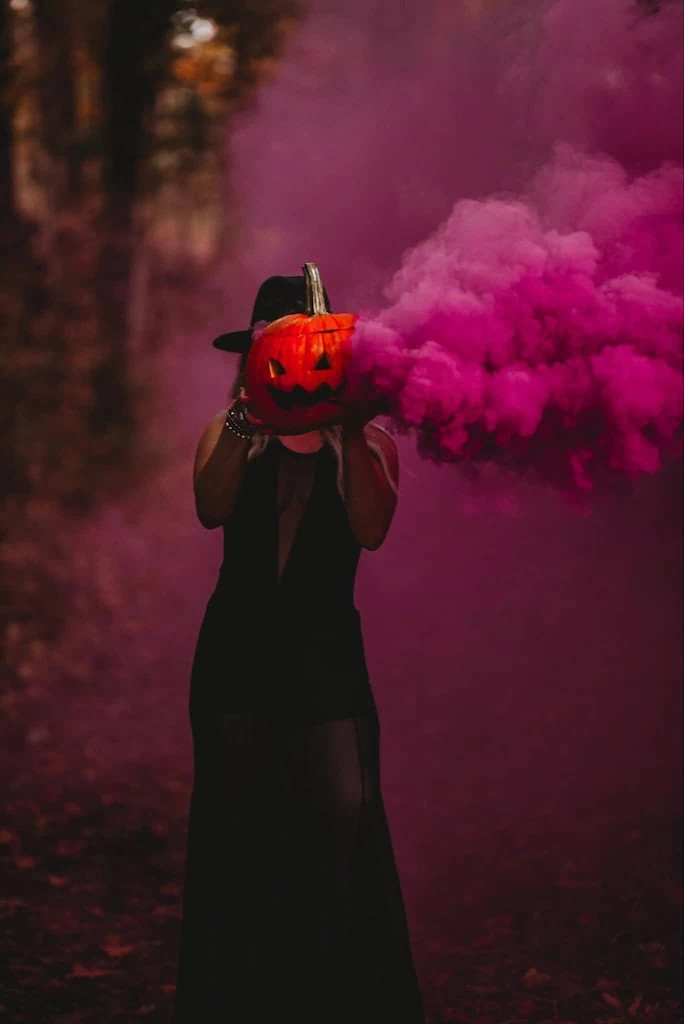 Pumpkin Head shot using a smoke bomb. Smoking pumpkin. Halloween photoshoot