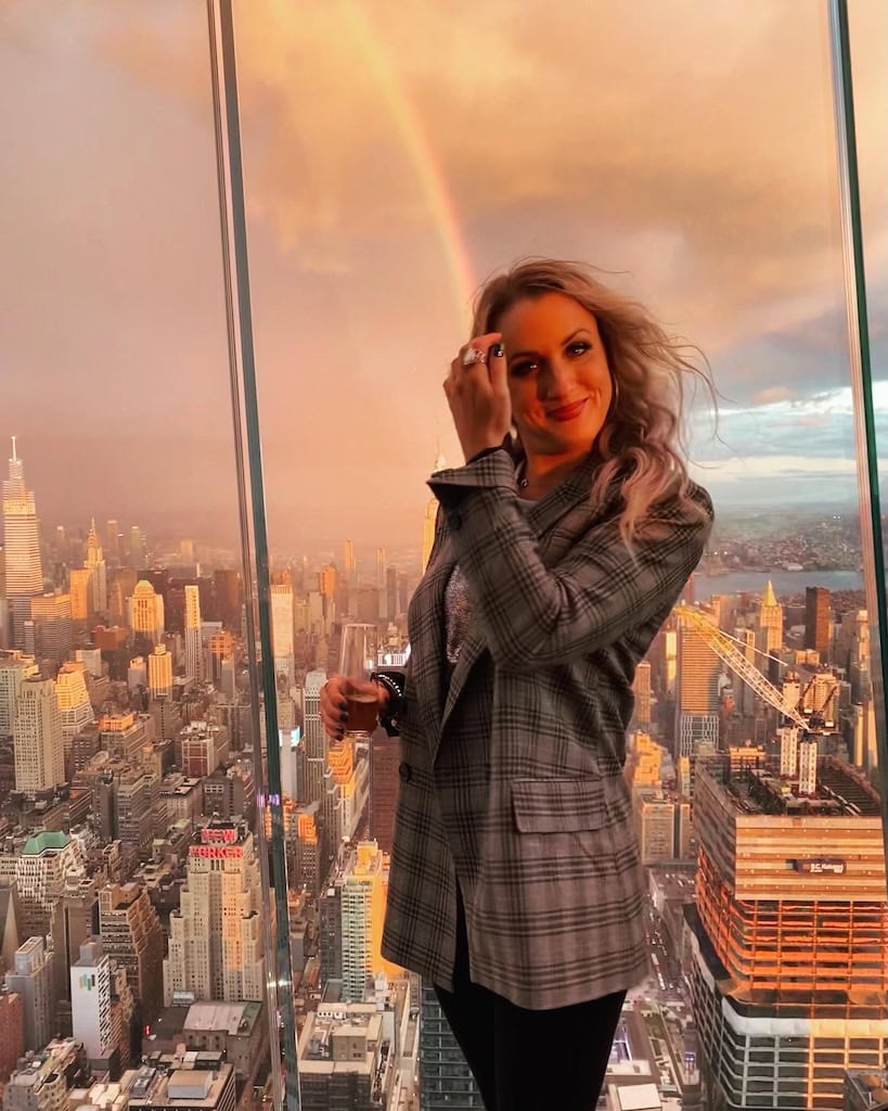 Girl with the Manhattan Skyline and a rainbow in the background