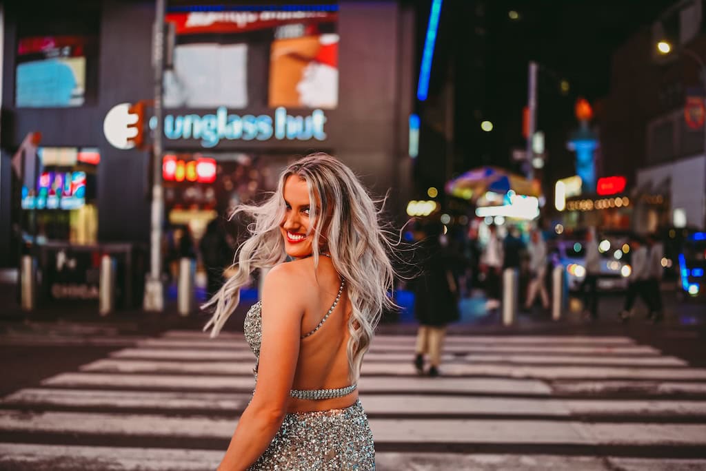 Girl in a sparkly dress in Times Square, NYC