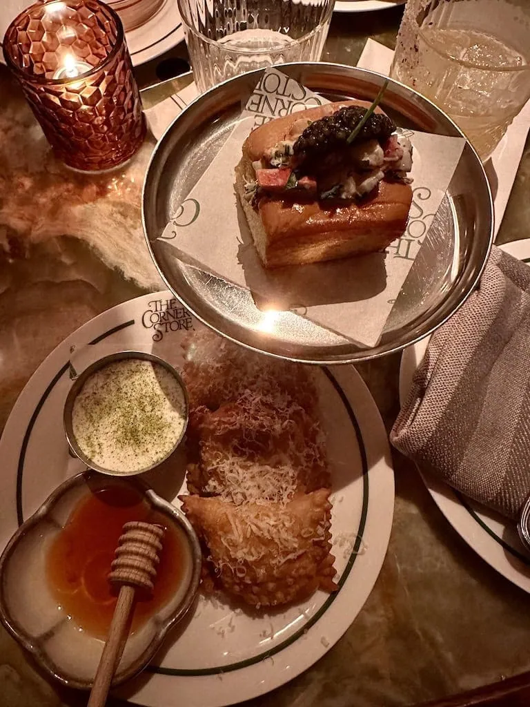 Lobster roll and pizza rolls with hot honey from The Corner Store in NYC