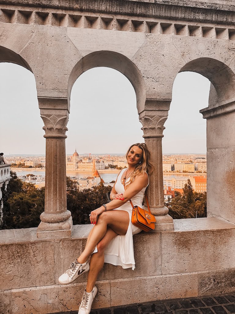 Girl sitting at Fisherman's Bastion in Budapest, Hungary