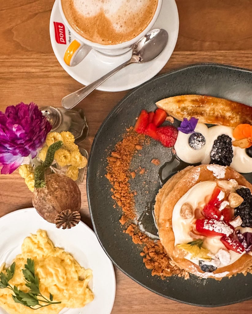 Fruit pancakes and scrambled eggs at Milk Bar & Bistrot; Barcelona, Spain