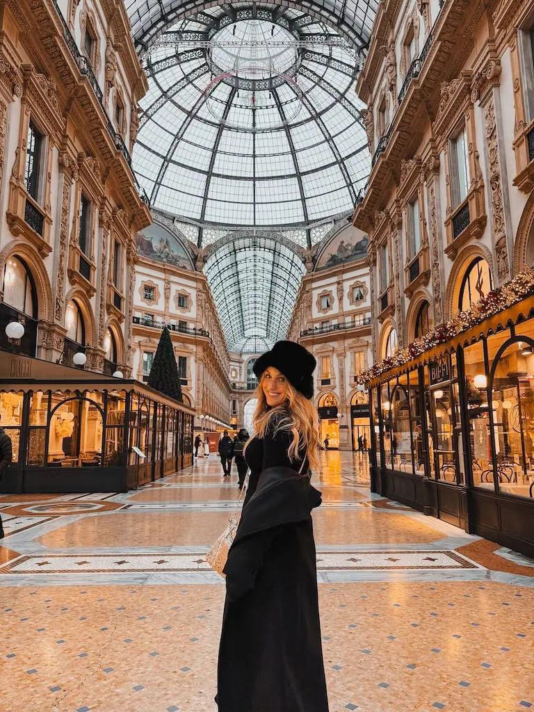 Girl standing inside the Galleria Vitorio Emanuele; Milan, Italy