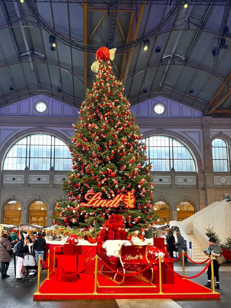 The giant Lindt tree at the Zurich Main Station Christmas market. Zurich, Switzerland.