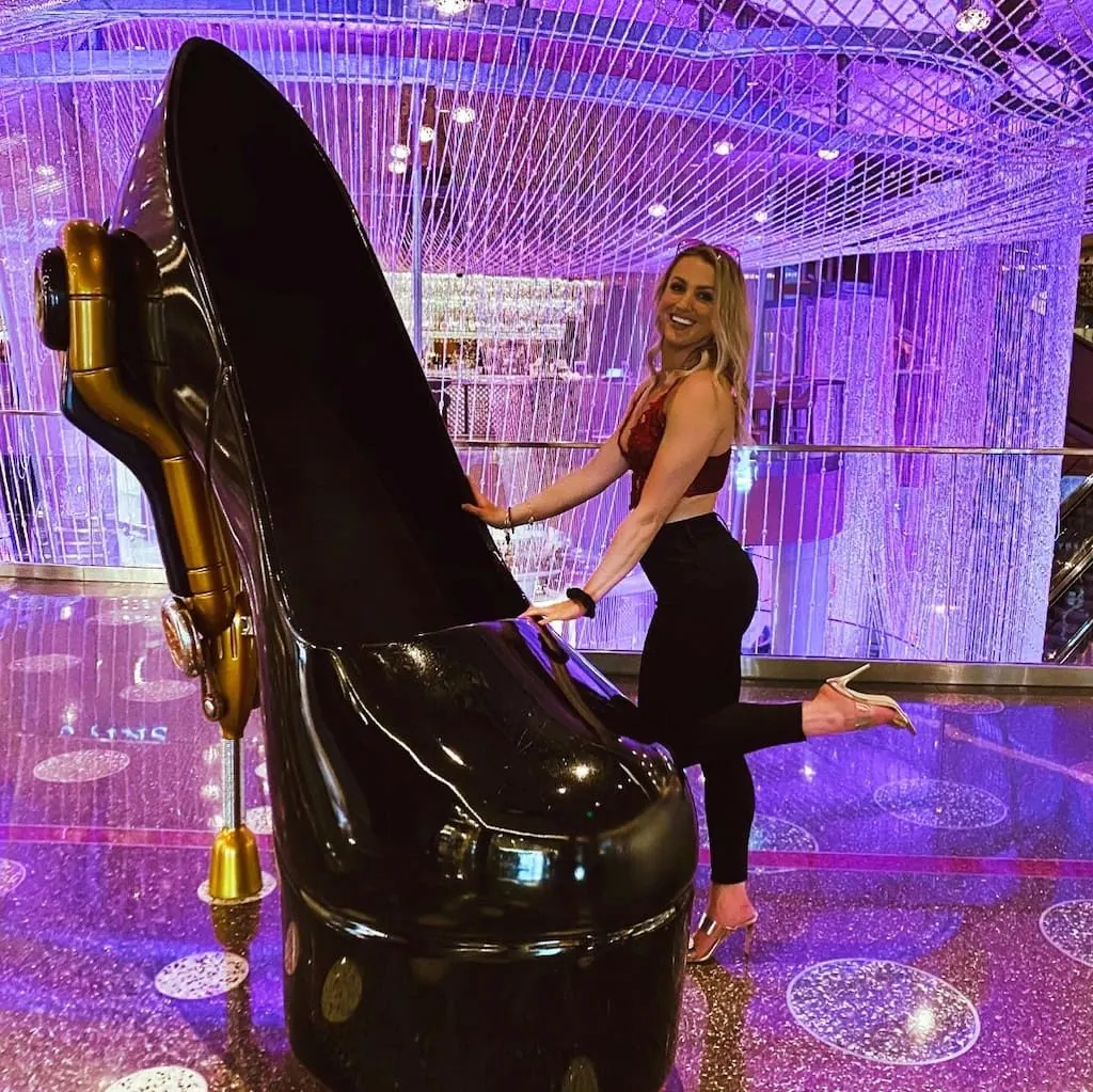 Girl by a high heel shoe in the Cosmopolitan hotel in Las Vegas