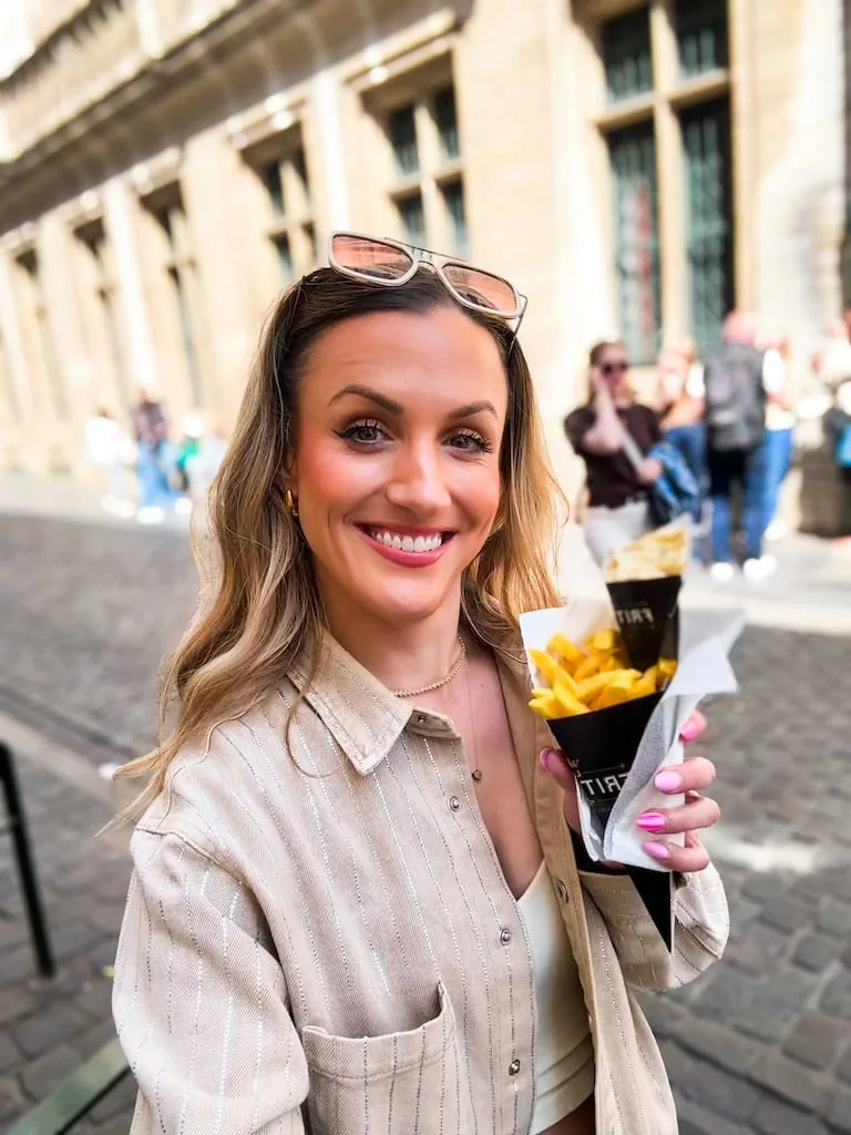 Girl with Belgian frites in Brussels