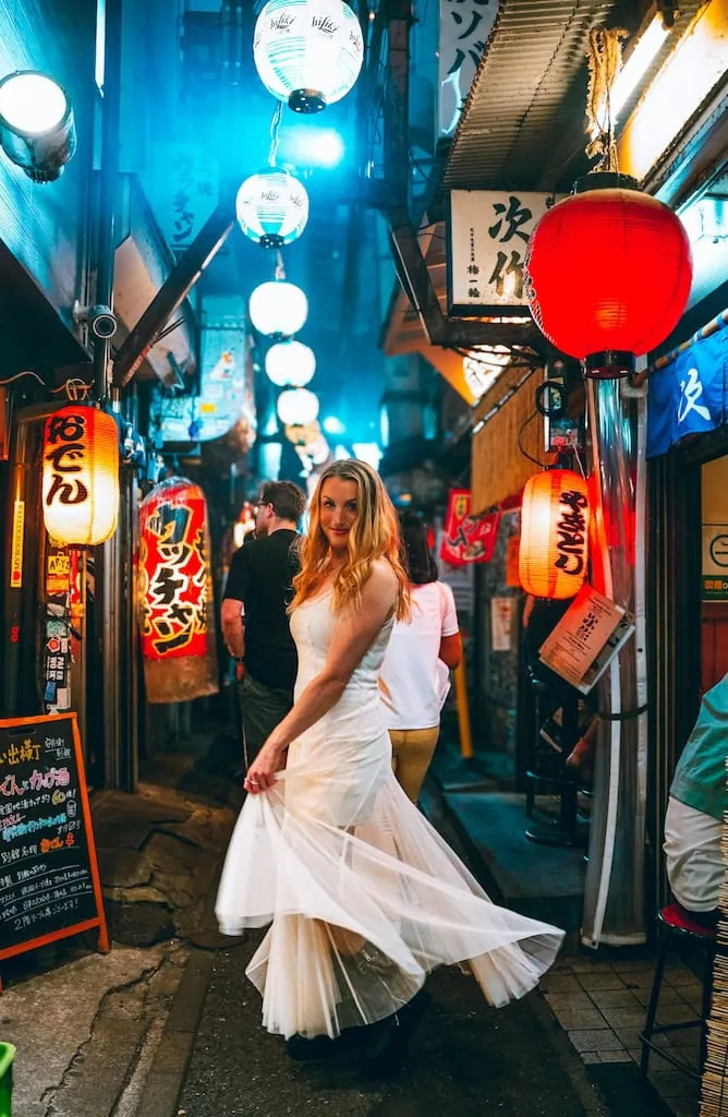Girl standing in Omoide Yokocho in Tokyo, Japan