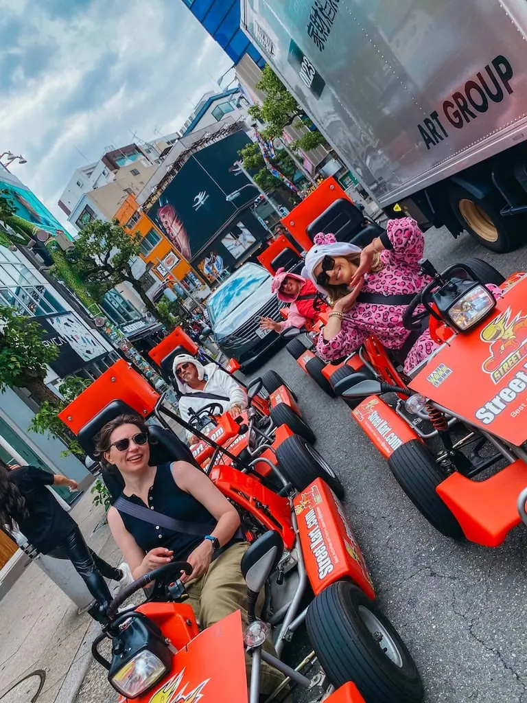 Group of people driving go-karts in Osaka, Japan